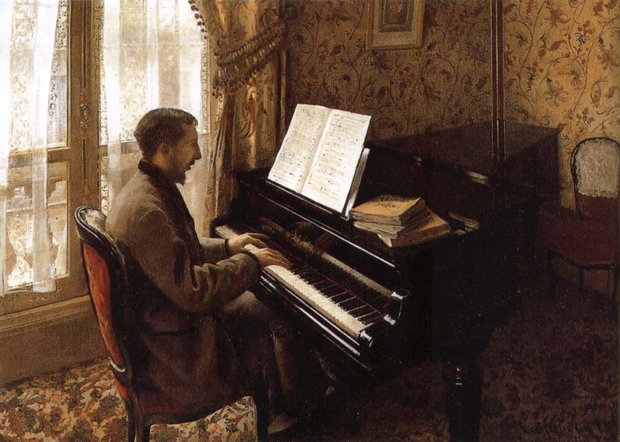 The young man plays the piano
